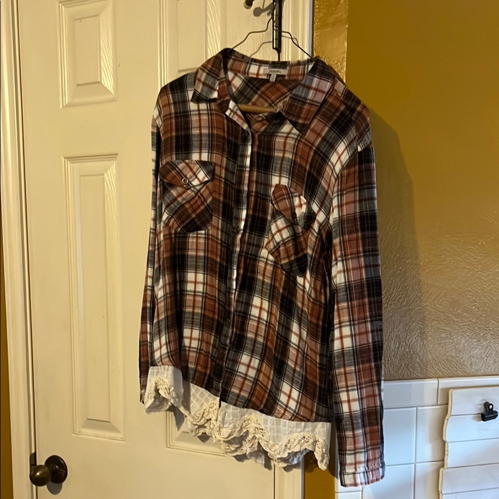 Plaid woman’s Shirt with Lace Hem. Put to pit is 17”. Size Small